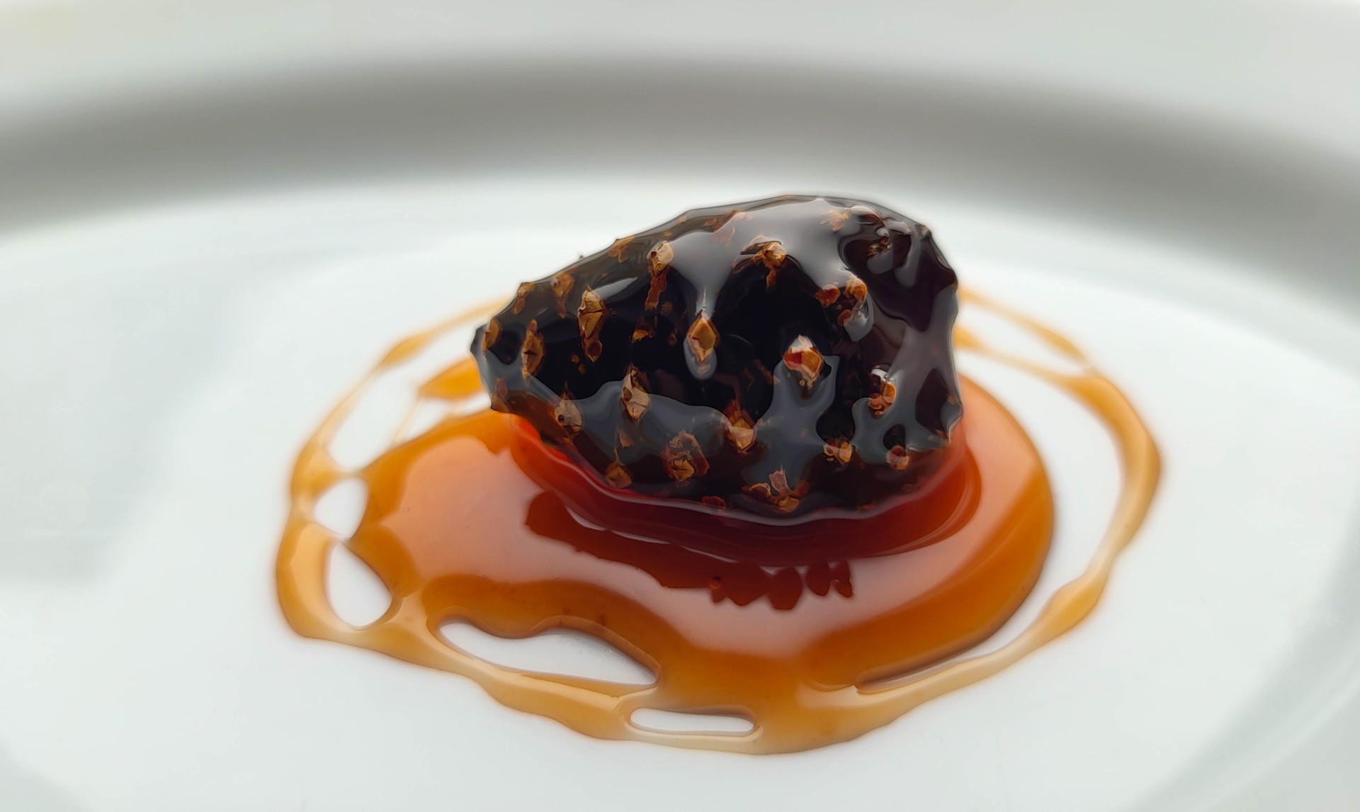 Fermented honey from pine cones. Jam made from young pine cones. A traditional Siberian healthy and delicious dessert is jam made from young pine cones on a white background.